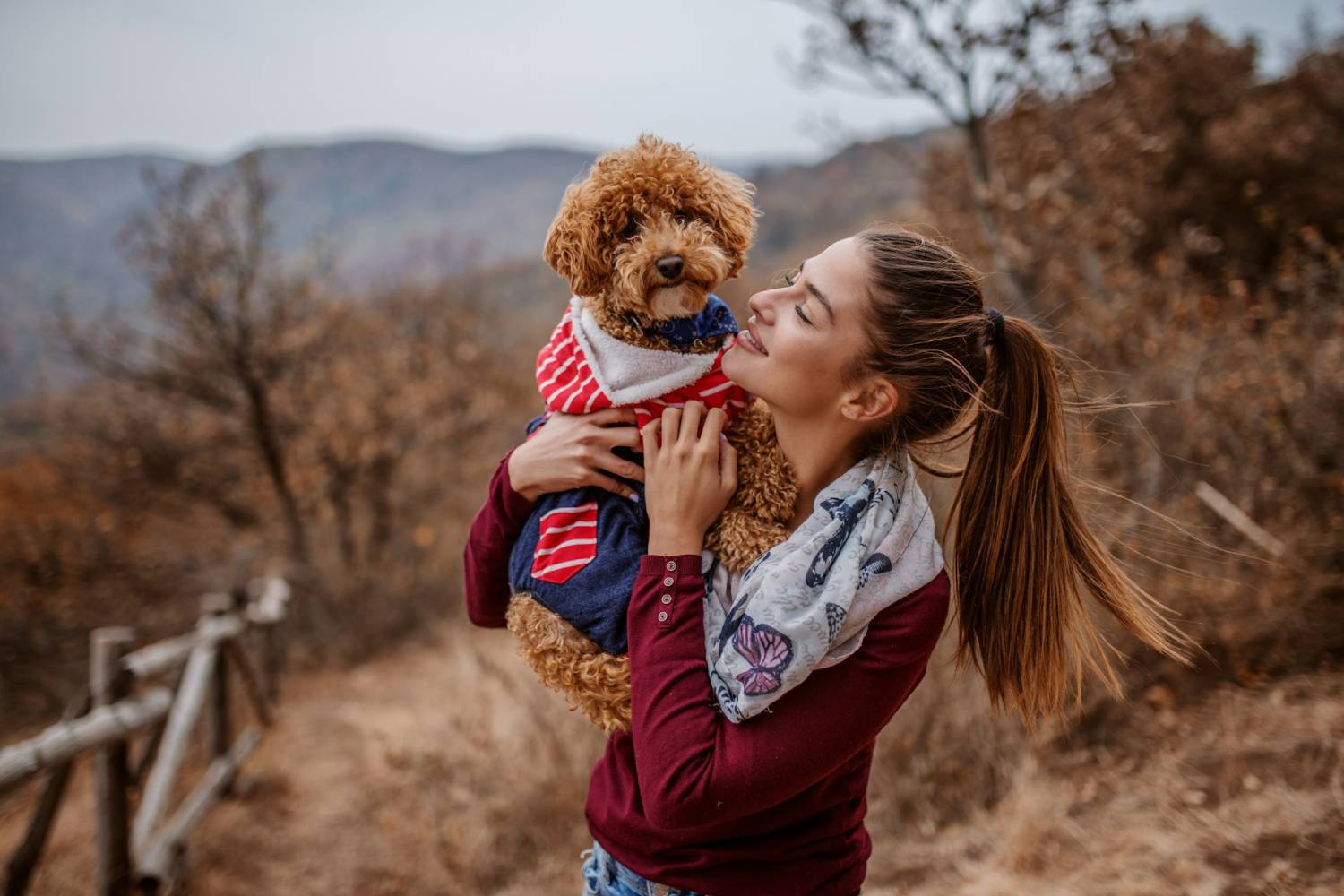 girl holding the pet