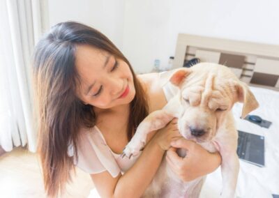girl holding the pet